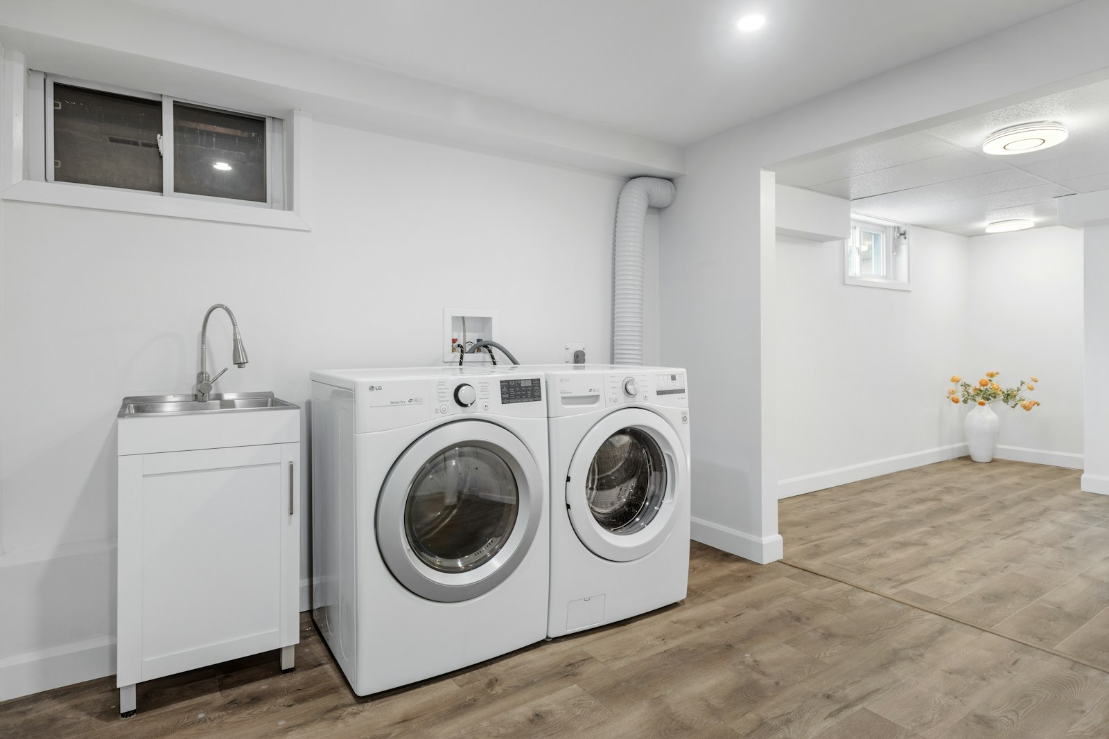 Home laundry room with washing machine and dryer